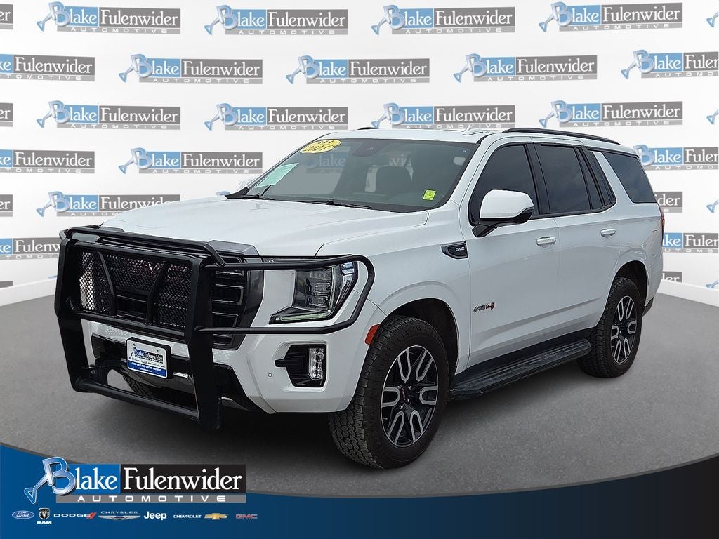 2024 GMC Yukon AT4 in Summit White — front three-quarter view