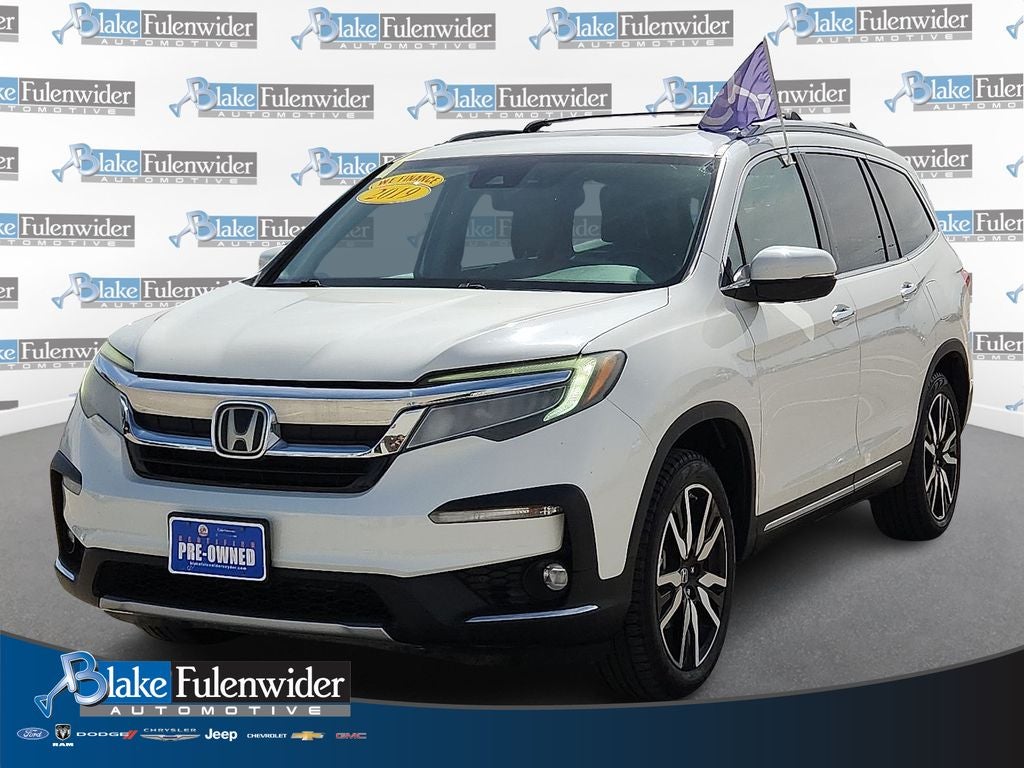 2019 Honda Pilot Touring 7 Passenger in White — front three-quarter view