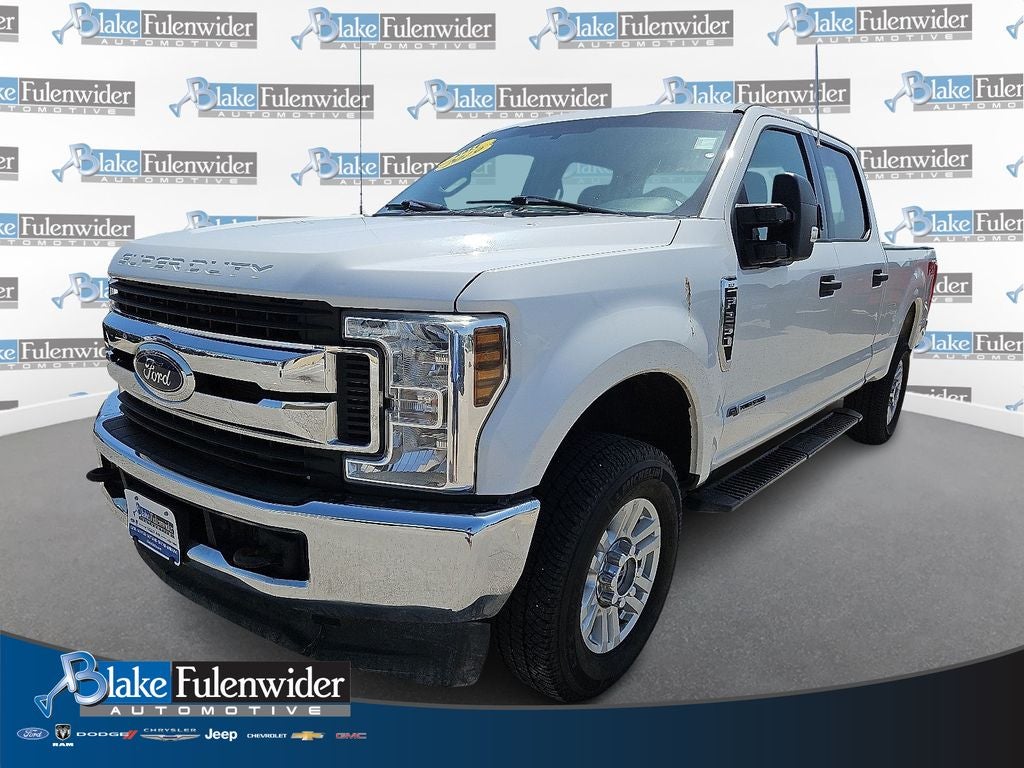 2019 Ford F-250 XLT in Oxford White — front three-quarter view